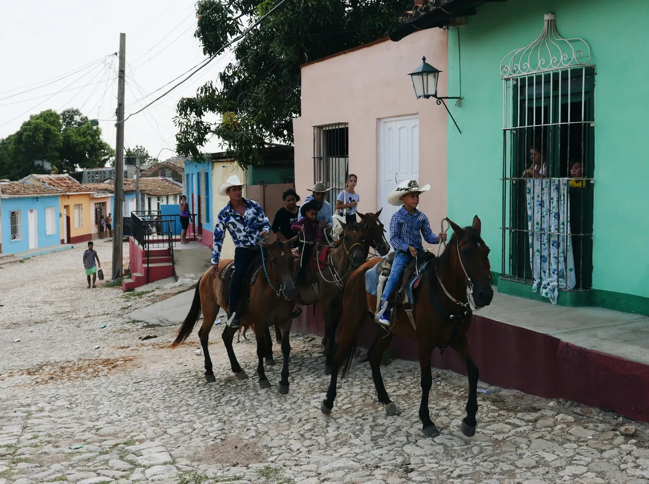 Farmers riding horses in a typical street in a country town. Photo by Falco Negenman.